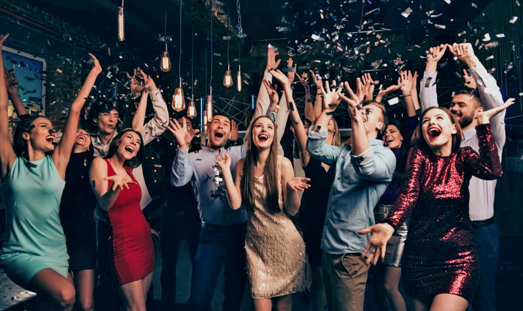 Corporate event guests celebrating on a lively Detroit dance floor
